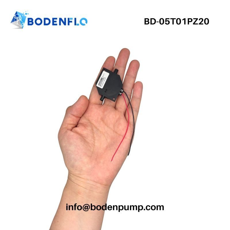 Mini piezo pump handheld showing ports and compact size BD-05T01PZ20