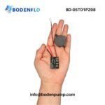 BD-05T01PZ08 micropump and driver board held in hand showing compact OEM integration size
